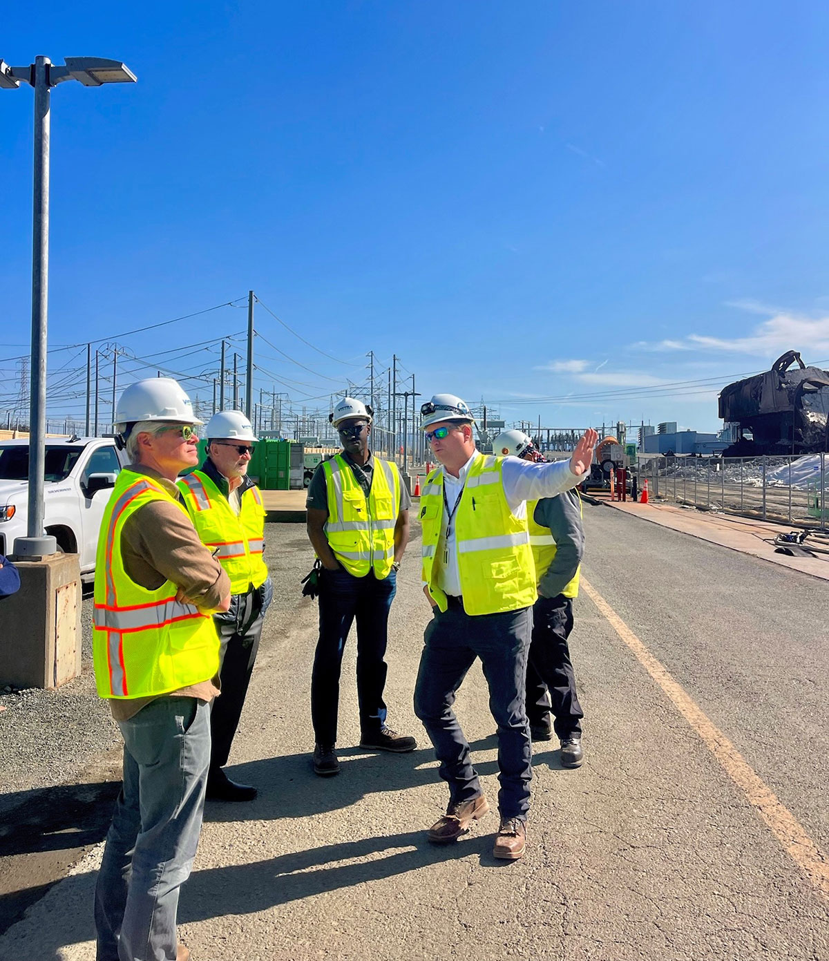 Senator John Laird and Monterey County Supervisor Glenn Church tour the Vistra battery energy storage facility in Moss Landing to review fire damage and ongoing cleanup efforts.