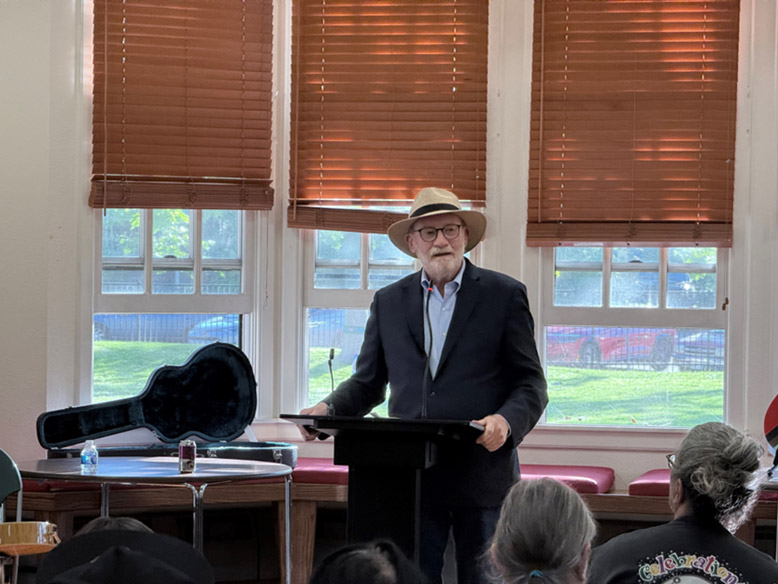 Senator Laird speaks at the opening of “Out of the Closets, Into the Streets” exhibit
