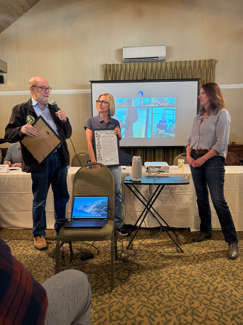 Senator Laird presenting a certificate of recognition at the Big Sur Multi-Agency Advisory Council to Karen Grimmer from the Monterey Bay National Marine Sanctuary.