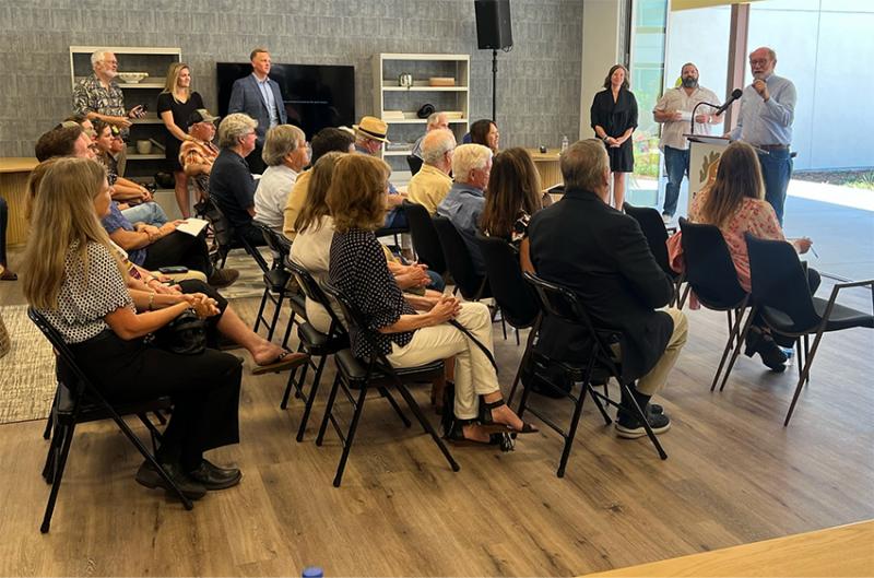 Senator Laird addresses seated attendees at the grand opening of the River Walk Terrace affordable senior housing project.