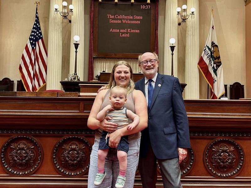 Sen. Laird standing on the Senate Floor with his niece and great nephew