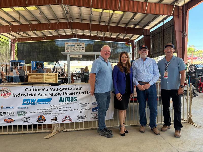 Sen. Laird taking a photo with Treasurer Ma at the Mid-State Fair during the Industrial Arts Show
