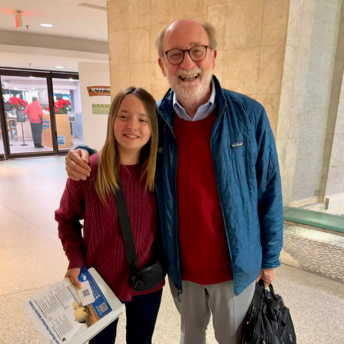 Senator Laird with young constituent Alyssa at a California Coastal Commission meeting.