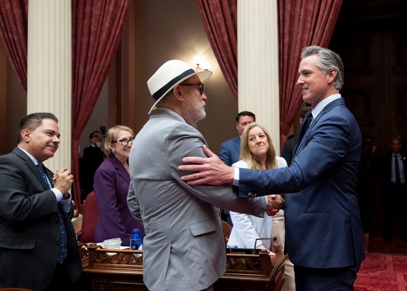 Senator Laird and Governor Newsom on Senate floor.